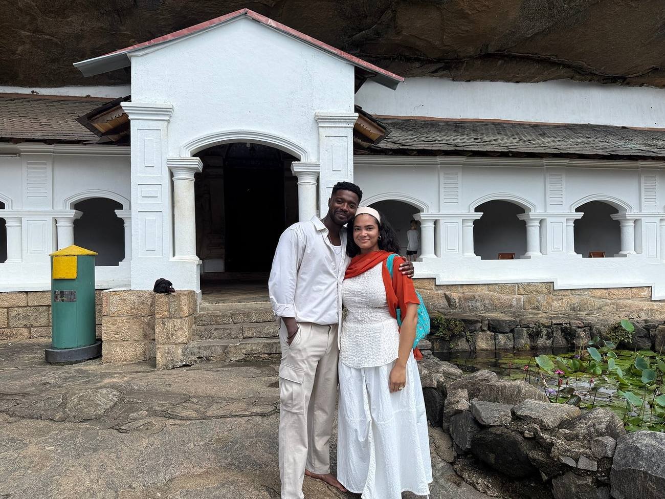 Travellers dressed for temple visiting outside the Dambulla Cave Temple