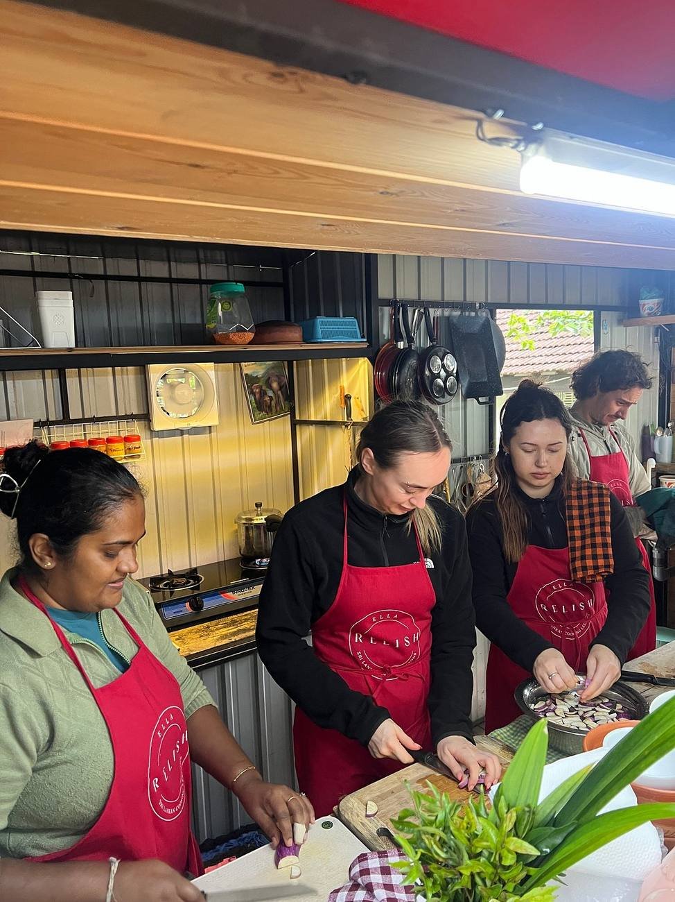 Travellers taking part in a Sri Lankan cooking class in Ella